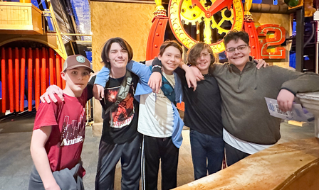 A groupd of teen boys enjoy an event at science museum oklahoma