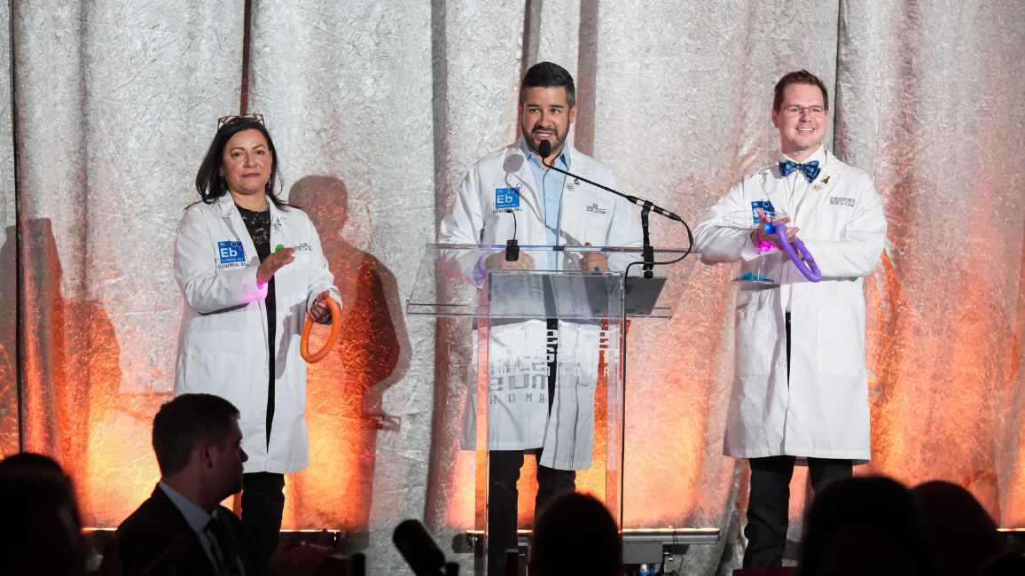 A guest explores fundraising opportunities at Elemental Ball at Science Museum Oklahoma