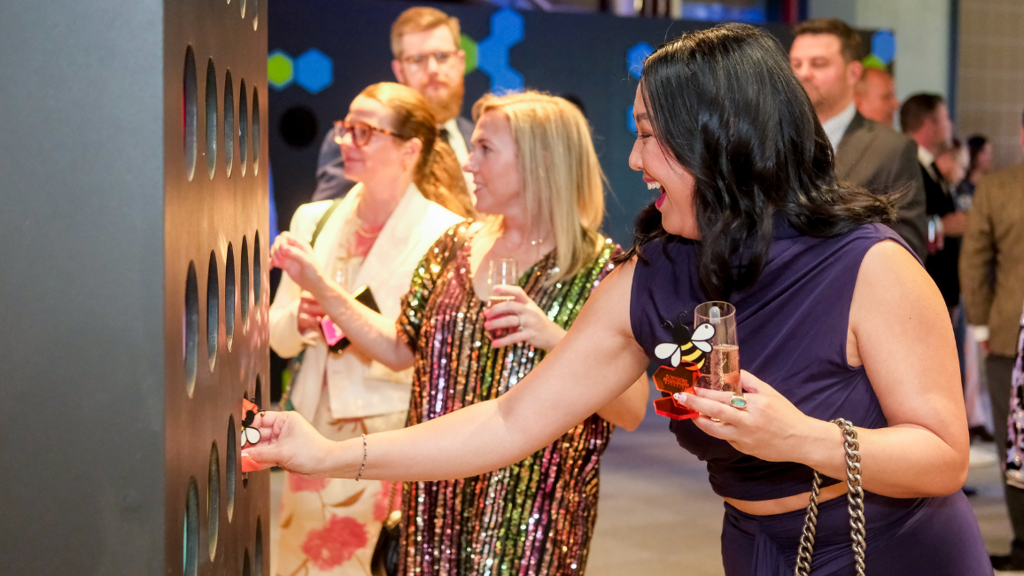 A guest explores fundraising opportunities at Elemental Ball at Science Museum Oklahoma