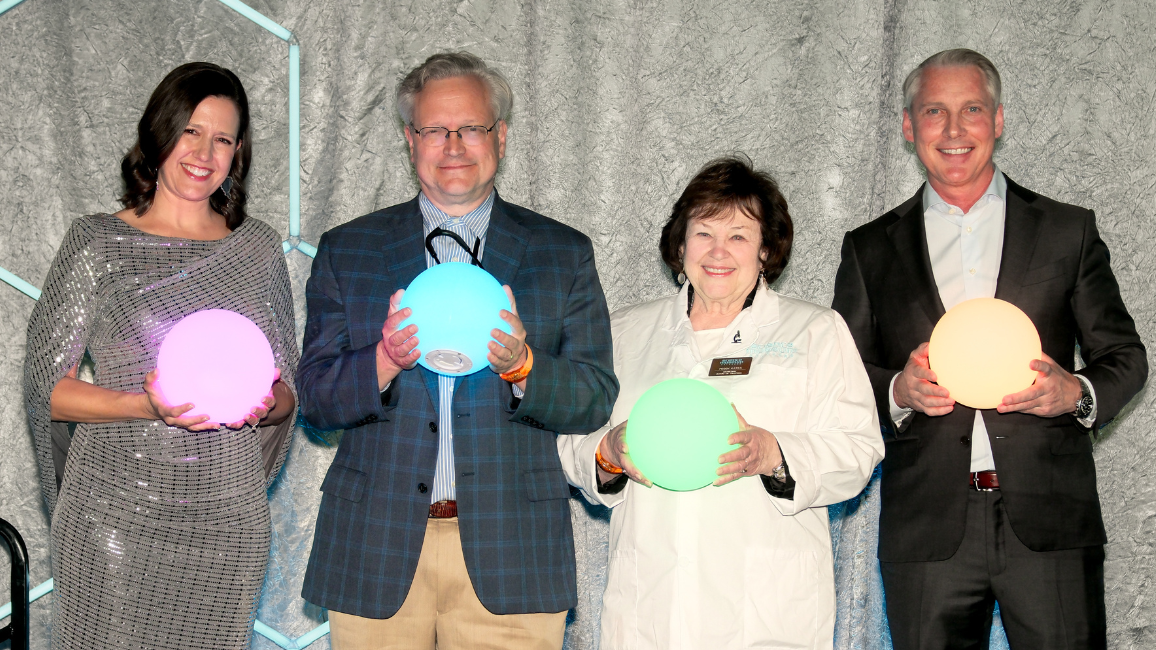 A guest explores fundraising opportunities at Elemental Ball at Science Museum Oklahoma