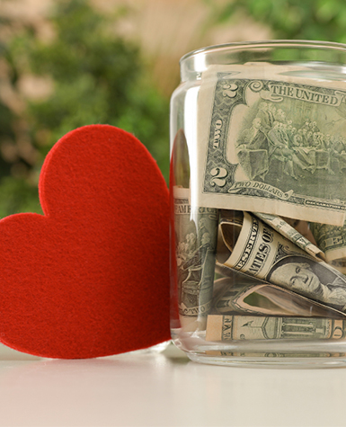Donation jar with a heart for giving to Science Museum Oklahoma