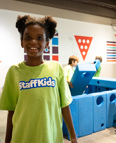 girl in staff kids shirtField Trips