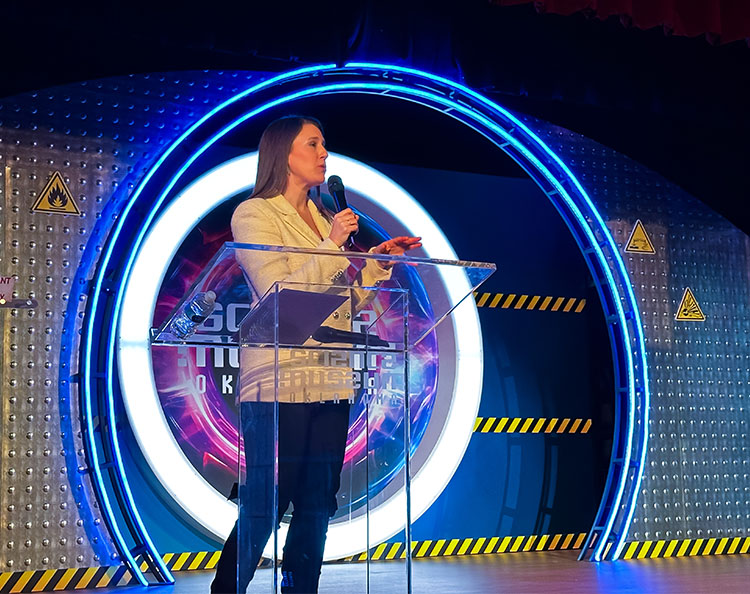 Science Museum Oklahoma presenter speaks on stage in the Science Live theater during a live STEM education program called 4Warn Storm School