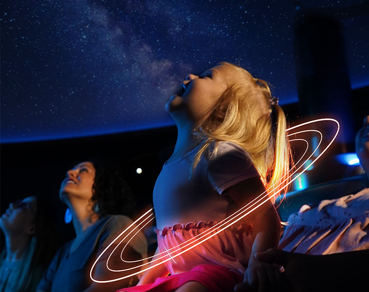 A child watches the stars in awe during a family-friendly show in the world-class Love’s Planetarium at Science Museum Oklahoma.