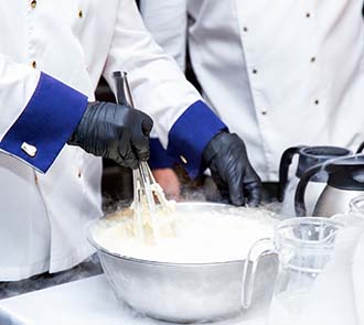Science educators prepare liquid nitrogen ice cream during a science-themed birthday party at Science Museum Oklahoma.