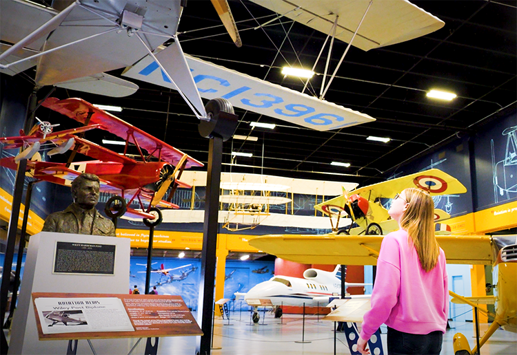 Girl looks at planes in aviation at science museum oklahoma