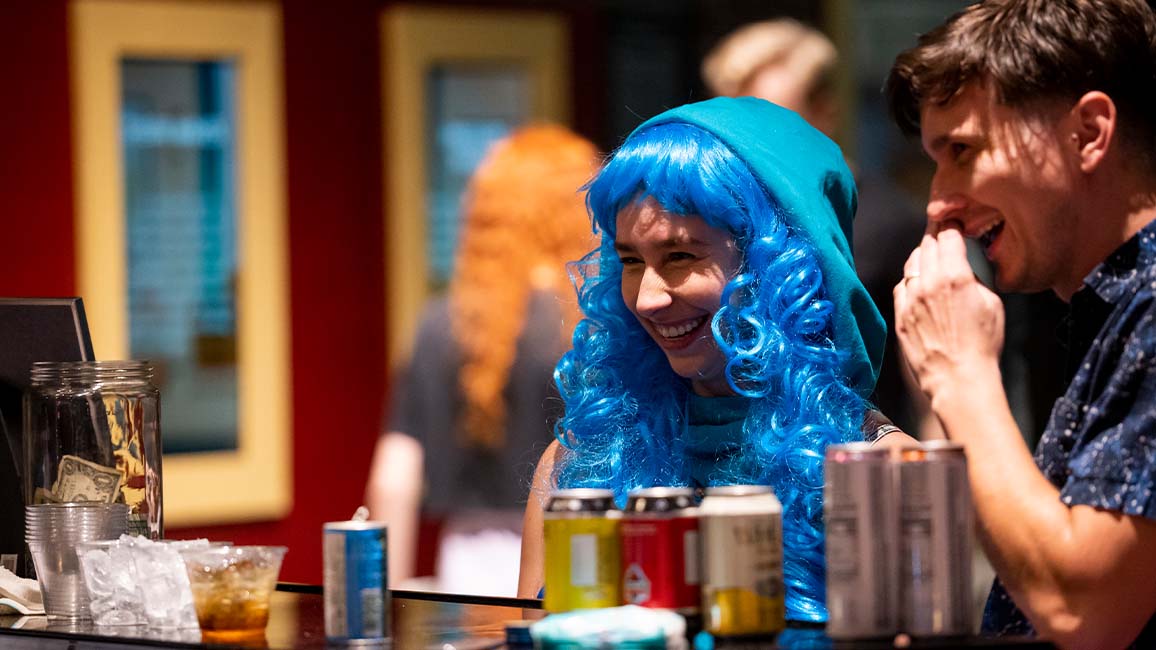 Guests in costume enjoy drinks and conversation at the bar during SMO21+ at Science Museum Oklahoma, an adults-only night of science, fun, and themed exploration.