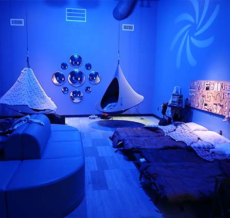 Sleeping bags line the sensory space within science museum oklahoma at an overnight sleepover in OKC
