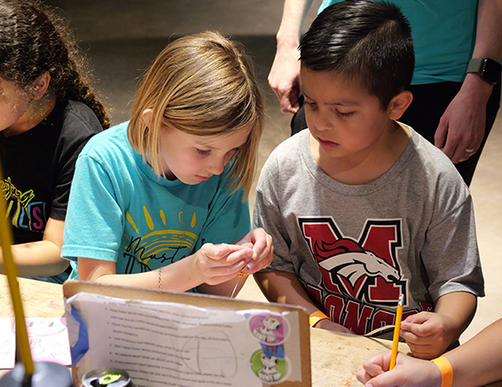 Two children make something together in Tinker Works at Science Museum Oklahoma