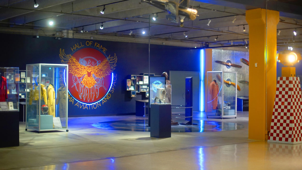 A spacious and artifact filled private event space in the Oklahoma Aviation and Space Hall of Fame.